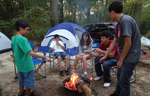 Electric tent campsite with fire ring at Beaver Trails