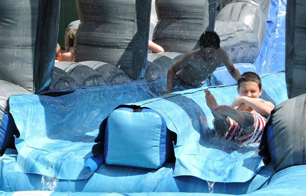 waterslide and inflatable fun zone at Adventure Bound Cooperstown